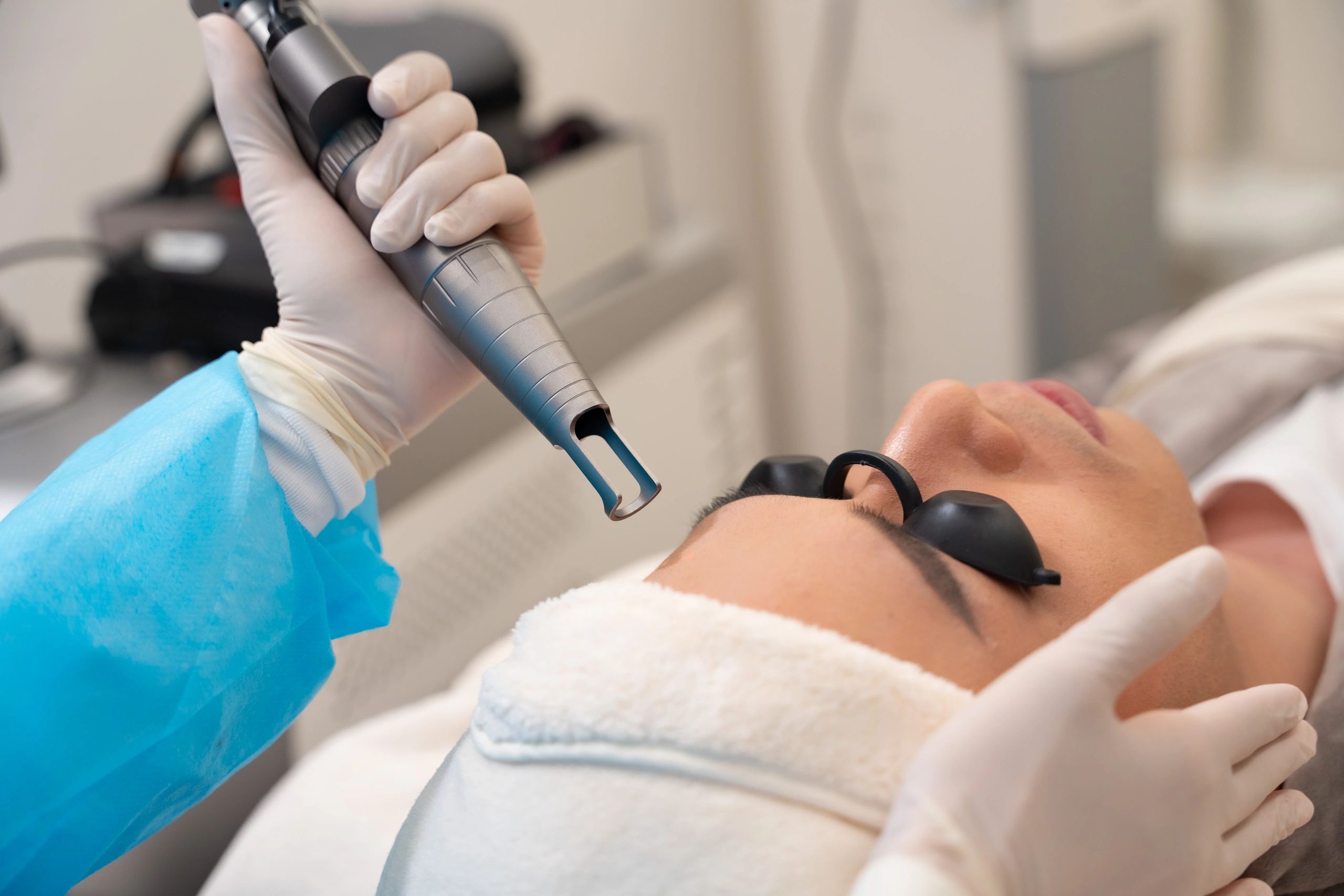 Professional laser treatment demonstration in a training setting